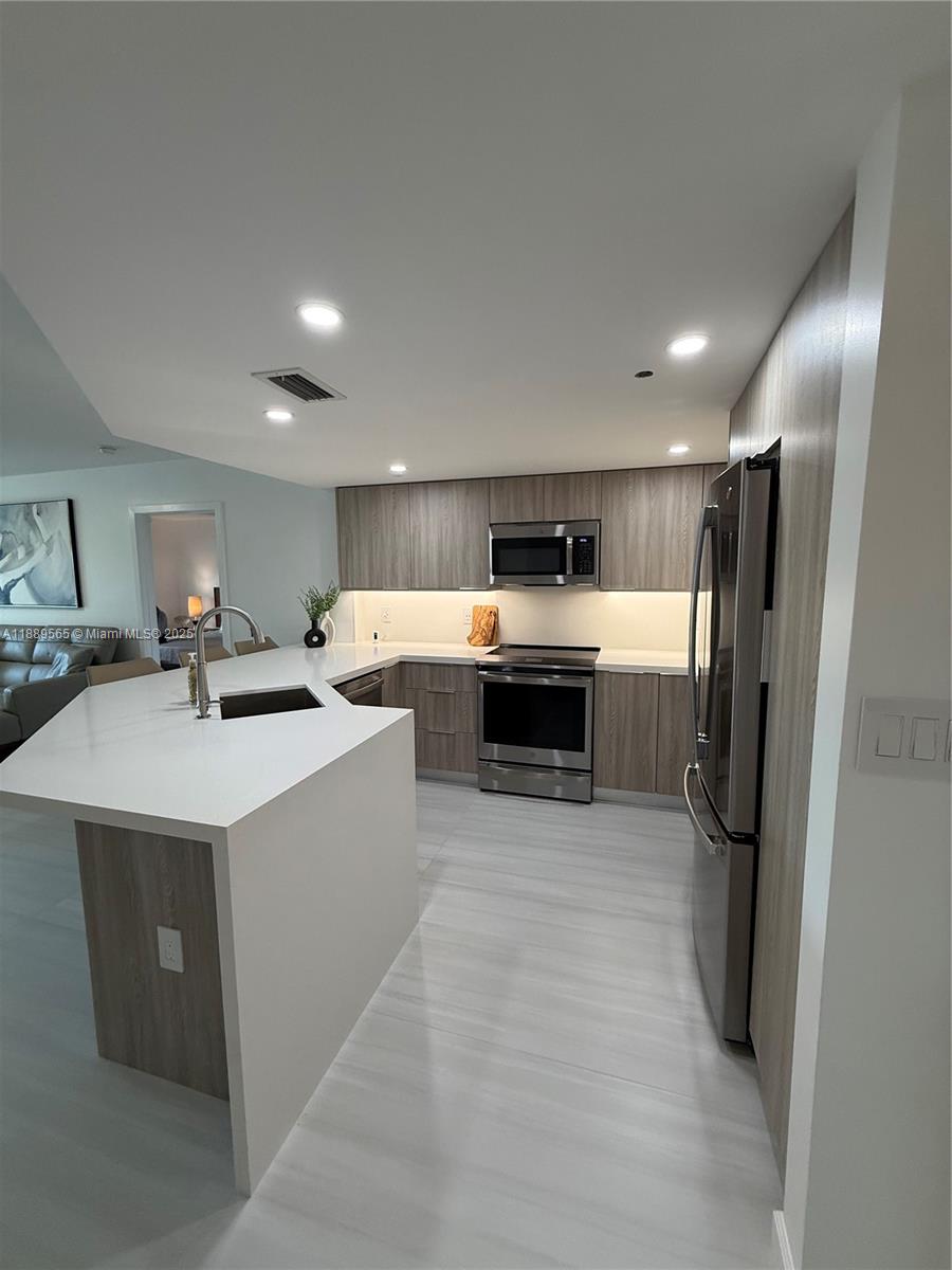 201 Golden Isles Dr #302, Hallandale Beach FL 33009