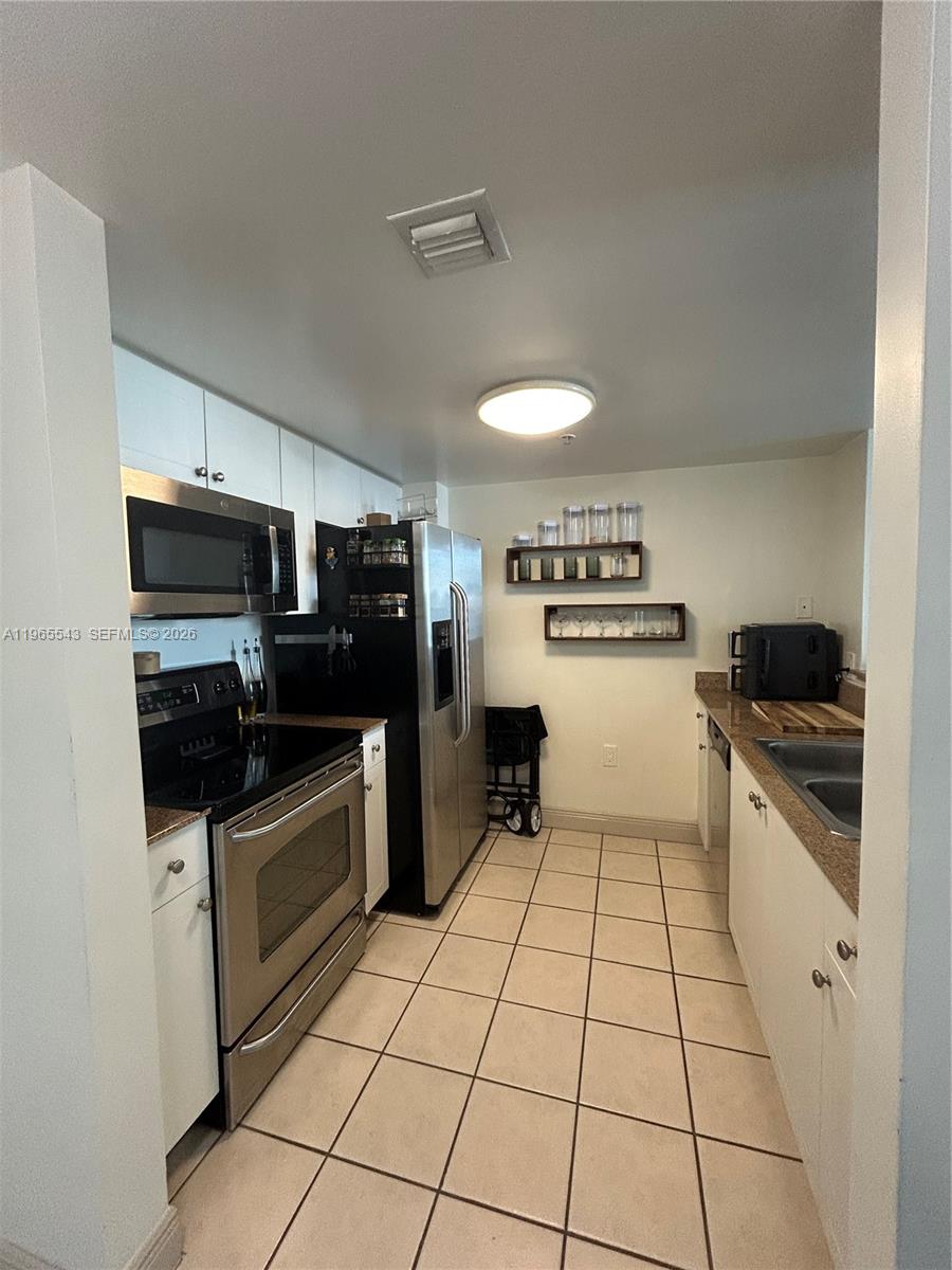 60 NW 37th Ave #1205, Miami FL 33125