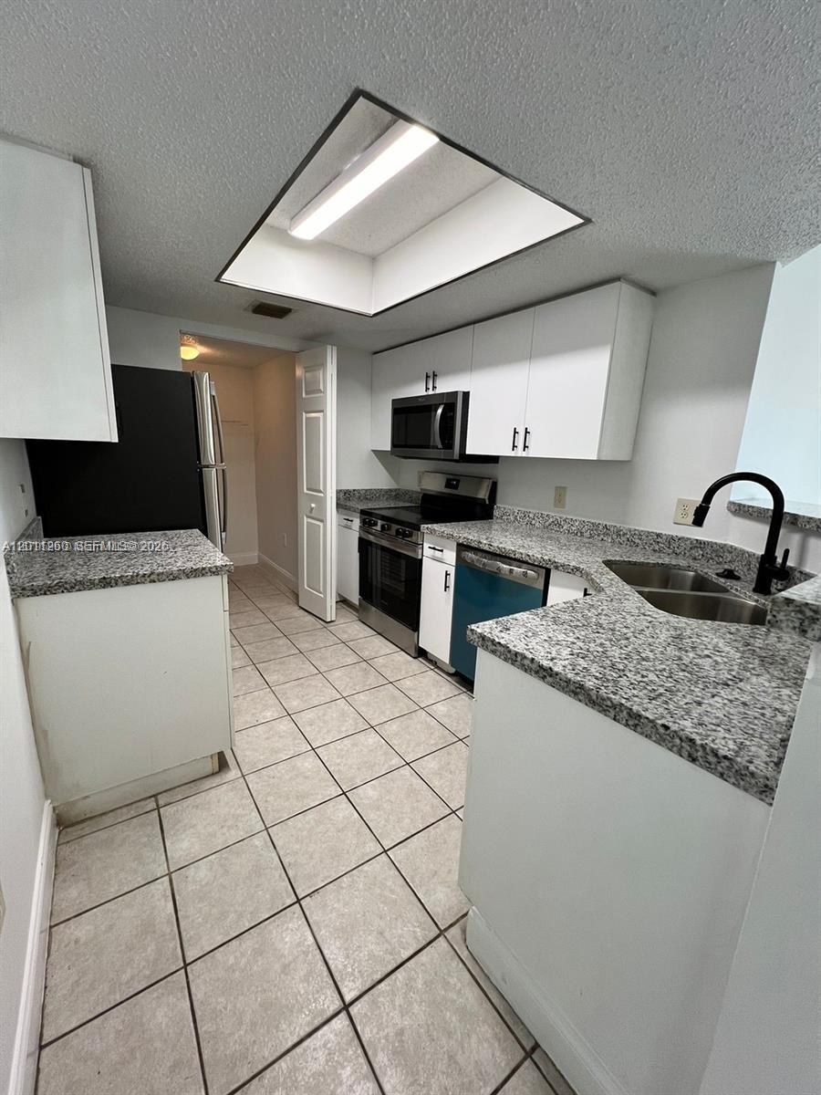 5065 Wiles Rd #103, Coconut Creek FL 33073