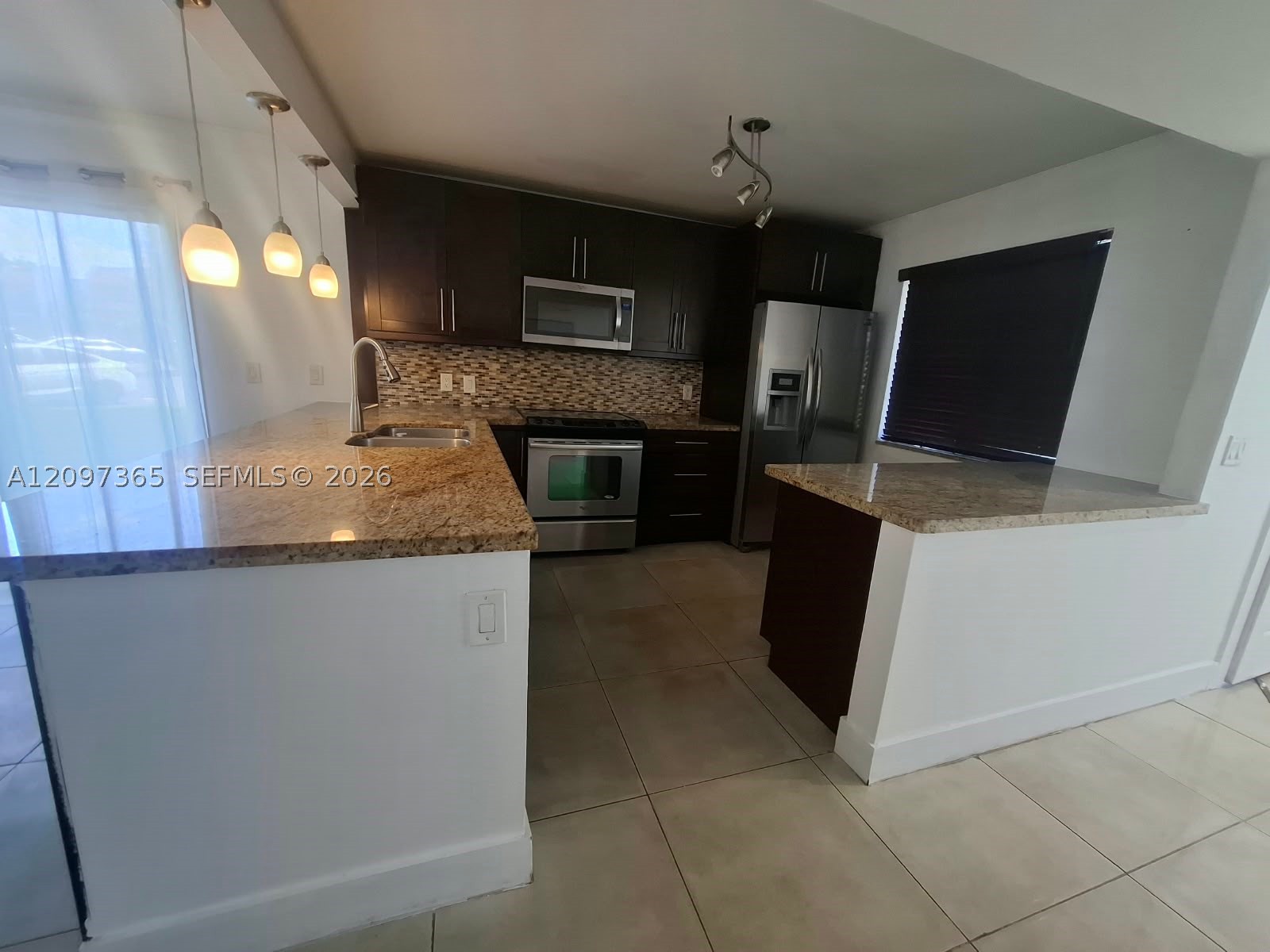 320 Racquet Club Rd #104, Weston FL 33326